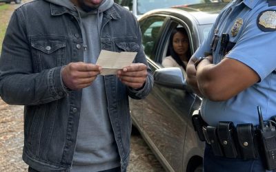 My wife got pulled over for speeding, and after the officer checked her license, he asked me to step out of the car. His face turned serious. “Sir, you need to hear me carefully. Do not go home tonight. Go somewhere safe.” I just stared at him. “What? Why?” He hesitated, then lowered his voice. “I can’t explain it here. But what I found is bad. Very bad.” Then he slipped a note into my hand. When I opened it, my whole world changed.