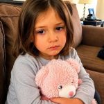 “My granddaughter stopped speaking after her father remarried — then she handed me her stuffed bear with a voice recording and a note that said, “”Listen when my new mom isn’t around.”” After my daughter Nora died, the only thing that kept me standing was my granddaughter, Sadie. She was six, with missing front teeth, pink sneakers, and a stuffed bear she carried everywhere like it was part of her body. I had given it to her for her birthday. It had a tiny recorder inside, so she could record a message, erase it, and record a new one. Sadie loved pretending the bear could talk back. After Nora died, she started whispering to it more than to people. Her father, Brent, was shattered at first. I won’t pretend he wasn’t. For months, he cried in my kitchen, forgot to eat, and asked me to help with school drop-offs because he couldn’t face the other parents alone. So when he remarried a year later, I tried not to judge. Even when the woman was Paige. Nora’s best friend. The one who had stood beside me at the funeral, holding Sadie’s hand and promising, “”I’ll always be here for her.”” Three weeks after the wedding, I visited their house with a casserole and a bag of Sadie’s favorite cookies. The moment I walked in, I knew something was wrong. Sadie sat on the couch, hugging her pink bear. “”Hi, sweetheart,”” I said softly. She looked at me, but didn’t answer. Brent sighed. “”She hasn’t been speaking lately.”” Paige smiled too quickly. “”It’s just an adjustment. New routines, new family. The therapist said we shouldn’t make a big deal out of it.”” But two months passed. Sadie still didn’t speak. Then one afternoon, while Paige was in the kitchen, Sadie climbed into my lap in the living room. Without a word, she pushed the pink bear into my hands. A folded note was tucked under its ribbon. In shaky letters, it said: “”Listen when my new mom isn’t around.”” Before I could ask what it meant, Sadie pressed one tiny finger to her lips. I nodded. I took the bear, slipped it into my bag, and said loudly that I was going to buy Sadie some candy before heading back to my place. “”Okay!”” Paige called from the kitchen. Then I stepped outside, turned the corner, pulled the bear out of my bag, and pressed play. What I heard made my knees weak. Like ❤️ if you’re already invested, the rest is below 👇.
