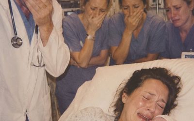 She walked into the hospital alone to give birth… and moments after her baby arrived, the doctor looked at him — and suddenly broke down in tears… Joanna walked into the hospital on a chilly Tuesday morning with no one by her side. No husband. No relatives. No friends. Just a worn suitcase, an old sweater, and nine months of heartbreak she had learned to carry by herself. At the reception desk, a nurse greeted her warmly. “Will your husband be joining you soon?” Joanna forced a small smile. “Yes… he should be here later.” It was a lie. Logan Wright had disappeared seven months earlier, the same evening she told him she was expecting a baby. There had been no fight. No screaming. No dramatic goodbye. Just a packed bag, a quiet excuse, and the sound of a door closing behind him. For weeks afterward, Joanna cried herself to sleep. Eventually, the tears stopped. Not because the pain disappeared. Because she had no energy left to keep grieving. She rented a tiny room, worked double shifts at a local diner, and saved every penny she could. Every night, she rested both hands on her growing belly and whispered to the little life inside her. “I’m here,” she would say softly. “I’m never leaving you.” When labor finally began, it came sooner than expected. Twelve exhausting hours followed. Each contraction stole her breath. Nurses coached her through the pain while she clung to the bedrails with shaking hands. Between waves of agony, she repeated the same prayer. “Please let my baby be healthy.” At exactly 3:17 that afternoon, her son entered the world. A strong cry echoed through the delivery room. Joanna collapsed back against the pillow, tears streaming down her face. But this time, they weren’t tears of sorrow. They were tears of relief. Of gratitude. Of unconditional love. “Is he okay?” she asked. A nurse carefully wrapped the newborn in a blanket and smiled. “He’s perfect.” The baby was about to be placed into Joanna’s arms when the attending physician stepped into the room. Dr. Robert Wright. Respected. Experienced. Known throughout the hospital for his steady composure and calm professionalism. He glanced at the medical chart. Then he looked at the baby. And instantly froze. The color drained from his face. His breathing stopped. His hand began to tremble. The room fell silent. Then, to everyone’s shock, tears filled his eyes. The doctor who had spent decades remaining calm during emergencies suddenly looked completely overwhelmed. Because the moment he saw that child… He recognized something. Something impossible. Something connected to a painful chapter of his own past that he had spent years trying to forget. As nurses exchanged confused glances, Dr. Wright stared at the newborn in disbelief. And within minutes, a revelation would emerge that would change the futures of Joanna, her son, and the doctor forever. (I know you’re all very curious about the next part, please leave a “YES” comment below! Part 2 will be updated below in the first c0mment )