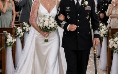 My father caught sight of the scars stretching across my neck and shoulder, took a slow step backward, and said in a hushed voice, “I’m not walking a damaged woman down the aisle.” Only three minutes remained before the wedding procession was set to begin when Richard Vale turned his back on me outside the chapel entrance. In that instant, the voices, the music, and the crowd all disappeared. The only sound left was the faint ringing that had haunted me ever since the explosion in the Arabian Sea. He straightened the silver cuff links on his sleeves before glancing toward the rows of politicians, corporate leaders, and decorated naval officers filling the chapel. “Those wedding photos will be around forever,” he said without emotion. “I won’t spend the rest of my life remembered standing next to… that.” To him, I was no longer Lieutenant Evelyn Vale. I wasn’t the daughter who had once emptied her savings to rescue his failing business. I wasn’t the officer who dragged three sailors through burning steel while flames swallowed the deck. I had become nothing more than an embarrassment. The scars across my skin seemed to sting beneath his judgment, but I refused to cover them. I had survived an inferno, countless surgeries, and months of painful rehabilitation. If I could endure all of that, I could endure my father’s rejection. Behind him, my sister Camille wore a satisfied smile. “Dad’s only thinking about the family’s reputation,” she said softly. “You really should have worn a dress with a higher neckline.” “I’m already wearing my wedding dress.” “Then delay the ceremony.” My fiancé, Daniel Mercer, took an angry step forward, but I gently caught his wrist before he could speak. “Not now,” I whispered. Mistaking my composure for surrender, Richard leaned closer. “If I refuse to walk with you,” he sneered, “you’ll have to go down that aisle alone. Maybe then everyone will understand what kind of woman comes home from deployment looking like a caution sign.” Before I could answer, the chapel doors swung open. Every guest wearing a military uniform rose to their feet. A hush settled over the room as four-star Admiral Helena Cross entered beneath the stained-glass windows, her white dress uniform glowing in the afternoon light. As Chief of Naval Operations, she held the authority Richard had spent years trying to impress, hoping her office would approve the lucrative contracts his company desperately needed. The color drained from my father’s face. The admiral stopped beside me. She studied the scars on my neck before turning her eyes toward Richard. “Your father may see only scars, Lieutenant,” she said as she offered me her arm, “but I know exactly what you sacrificed to earn every one of them.” The silence broke apart. As Admiral Cross escorted me down the aisle, applause erupted from the naval officers before spreading through the entire chapel. Daniel blinked back tears while my father remained frozen near the entrance, forgotten by the very audience he had tried so desperately to impress. When we reached the altar, the admiral leaned in and spoke quietly. “The investigation file landed on my desk this morning.” I kept smiling for the guests. “Is the case solid?” She gave a faint nod. “Solid enough to bring down an entire fleet.” Across the chapel, Richard slowly realized the admiral hadn’t attended simply to witness my wedding. She had come for him. To be continued in the comments. 👇.