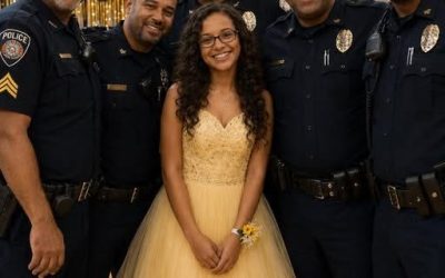 MY HUSBAND D:IE, SO I WENT TO THE FATHER-DAUGHTER DANCE AT SCHOOL TO SUPPORT OUR DAUGHTER — HER CLASSMATES LAUGHED UNTIL FIVE POLICE OFFICERS WALKED INTO THE GYM. This year, my 13-year-old daughter, Mia, didn’t want to attend the school father-daughter dance. Every year before, my husband always took her. He’d buy Mia flowers, walk her to the car, and drive her to school. Then he’d dance with her like she was a princess. Mia loved that night. Until this year. My husband was a police officer, and he d:i in the line of duty six months ago. After that, our lives changed completely. So when the school announced this year’s dance, Mia became quiet and emotional. I wanted to support her however I could. Even though I knew I could never replace her dad, I still offered to go with her. “Yes, Mom,” she whispered. “Let’s go. For Dad… I still want to be there.” She wore a beautiful dress, curled her hair, and I drove her to the school gym. At first, everything felt okay. We drank punch and took photos together. Then the DJ announced the father-daughter dance. The girls rushed toward their dads. But when Mia walked onto the dance floor with me, a few classmates started laughing. One kid shouted: “OH MY GOD, DO YOU NOT KNOW WHAT A MAN LOOKS LIKE?” Another yelled: “WHY WOULD YOU EVEN COME IF YOU DON’T HAVE ANYONE TO DANCE WITH?” Then someone else added: “THIS IS PATHETIC. YOU DON’T BELONG HERE!” Mia burst into tears. A teacher hurried over and quietly asked us to step away before things became “a bigger scene.” I wiped Mia’s tears and was about to take her home when suddenly, the gym doors opened. Five police officers walked inside. They headed straight toward us. Everyone stared. The music stopped. One officer looked at me and said: “Ma’am, I need to ask you to step off the dance floor.” My heart dropped. I thought maybe I had done something wrong. But I never expected what those five officers did next. If you want to read the full story, type OK in the comments below. Then tap “view all comments” and check my first comment for the full story